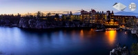 Panoramic photograph of the historic Mohonk Mountain House and lake at sunset with a long exposure