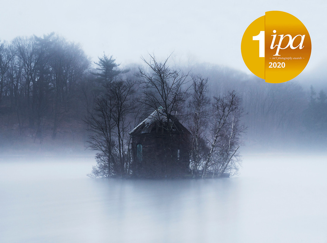Abandoned building surrounded by trees, water and fog in Tarrytown, Westchester County, NY