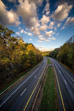 Photograph of Rt. 117 in Sleepy Hollow, New York State Hudson Valley with the sky at dusk and clouds